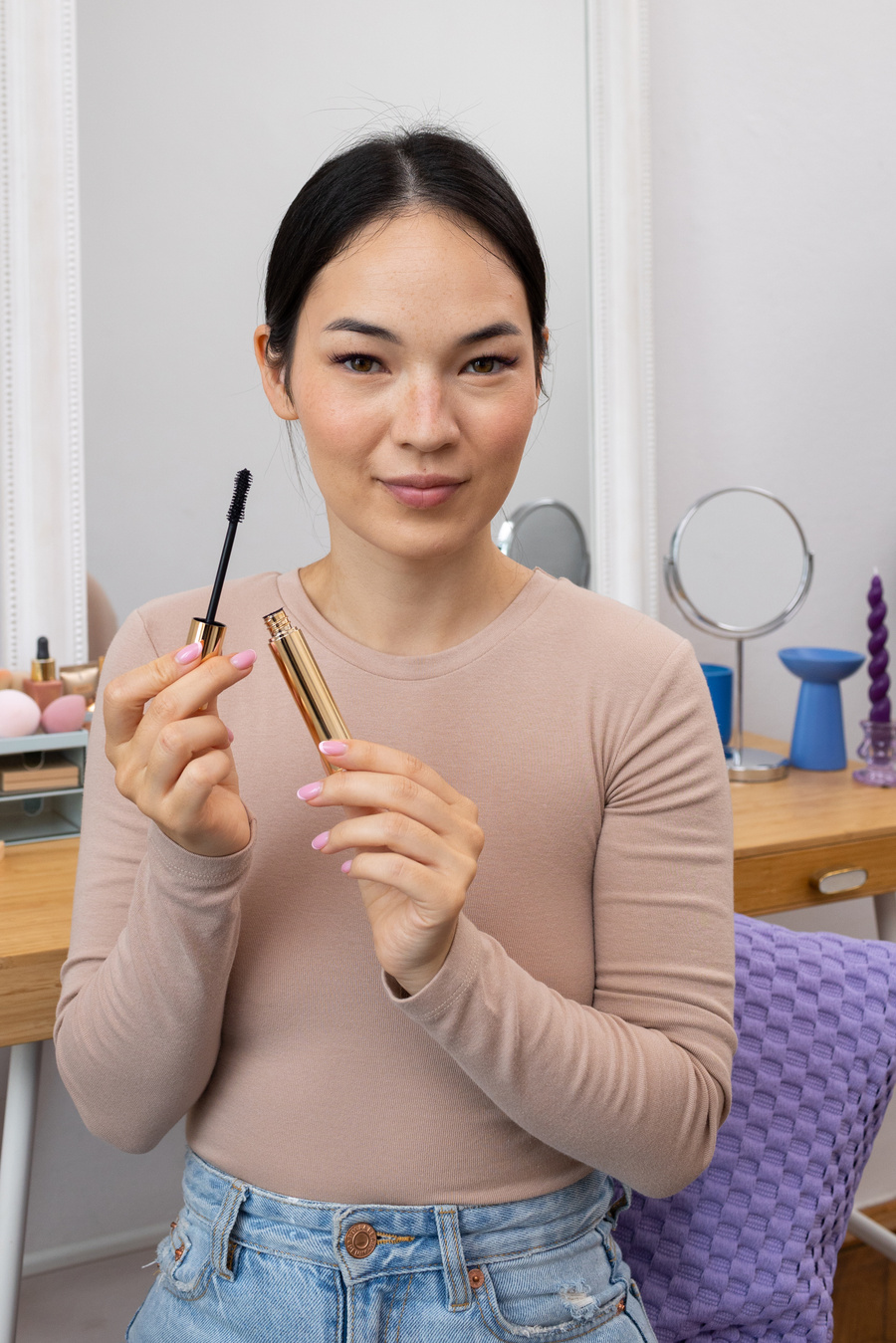 Woman Holding a Mascara